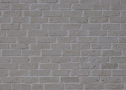 High-resolution image of a white painted brick wall with natural texture.